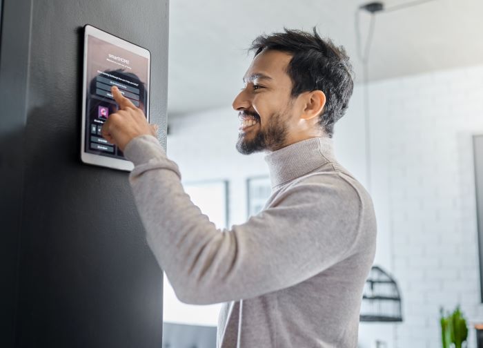 Artificial General Intelligence: man smiling in his smart home